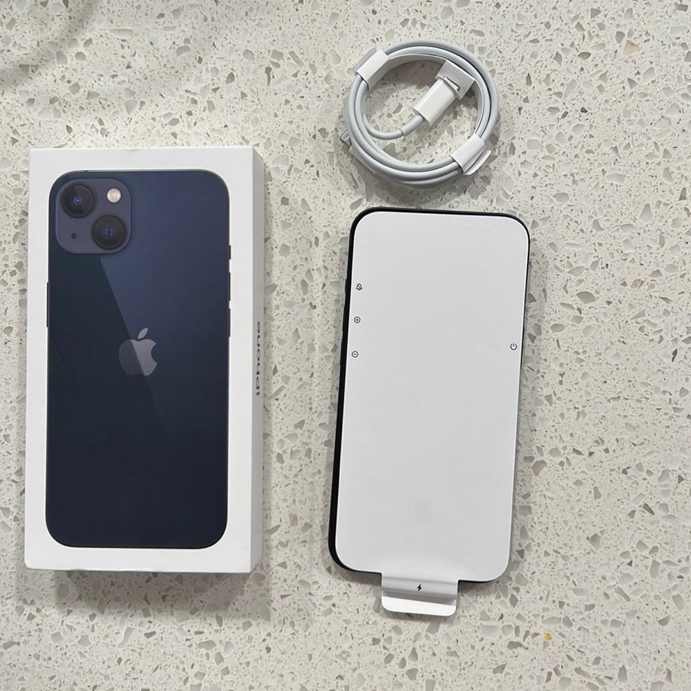 Brand new. Still has the pell off on screen. 128G. Midnight color. iPhone 13
